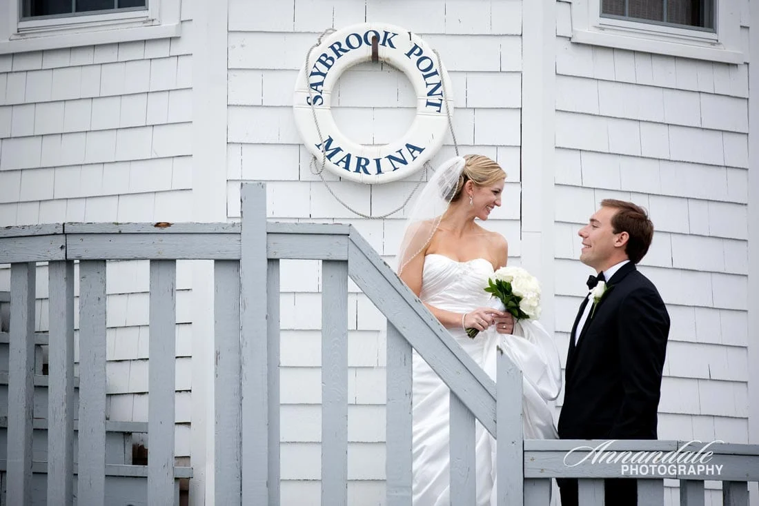 Bridal couple together at Connecticut lighthouse.