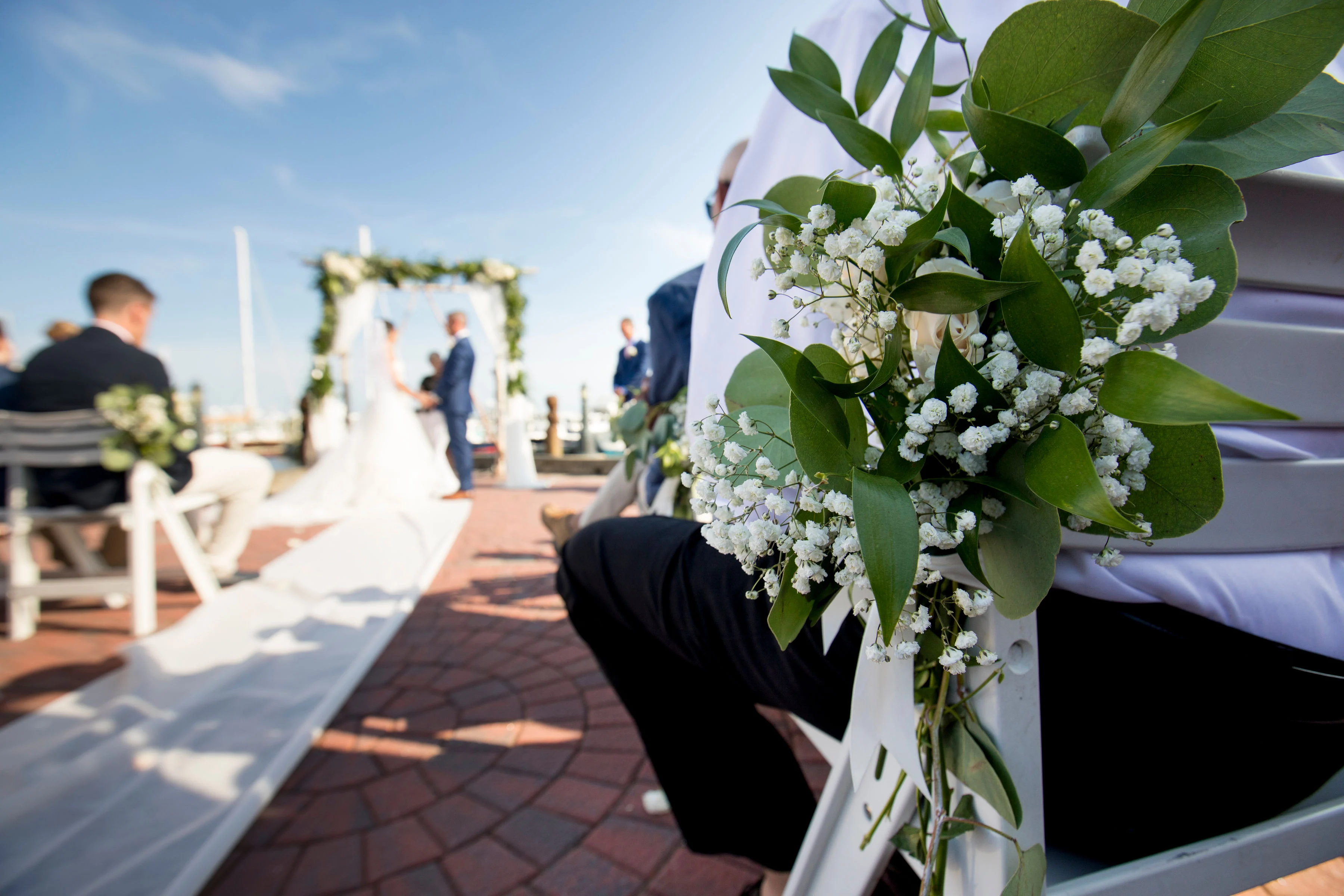 Wedding flowers on ceremony seating.