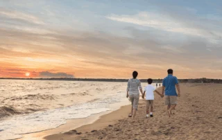 Photo of a Family Walking on the Beach in Old Saybrook CT.