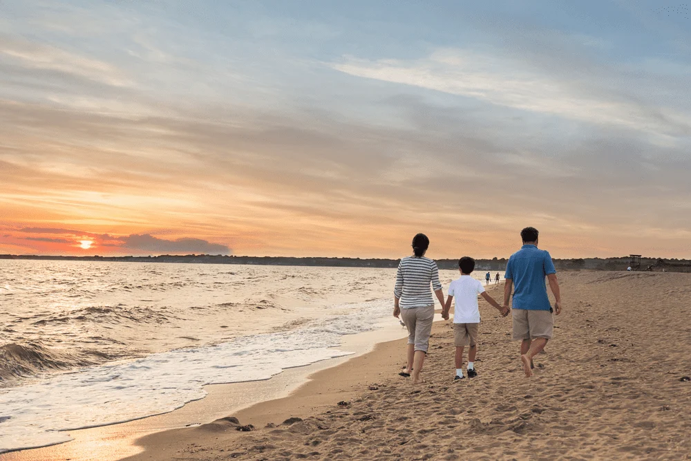 Photo of a Family Walking on the Beach in Old Saybrook CT.