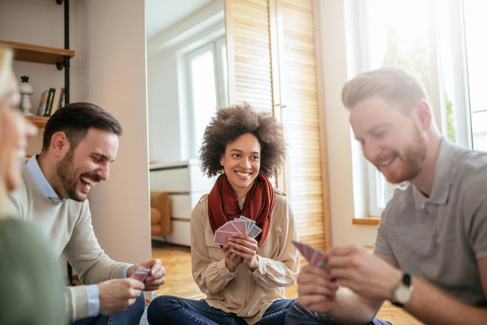 Photo of Friends Playing Games in Hotel